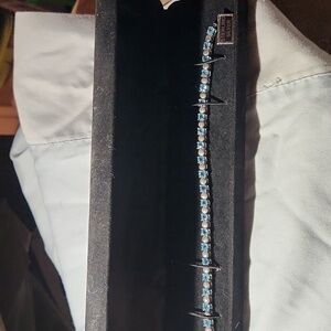 Blue topaz and silver tennis bracelet